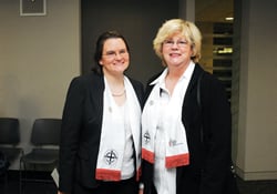 Deaconesses Becky Louter (left) and Nancy Garrison visit at a commissioning service for new deaconesses and home missioners. Louter leads the Office of Deaconess and Home Missioner for United Methodist Women. Garrison serves on a ministry with older adults on Swannanoa, N.C.