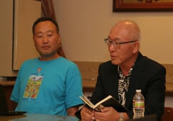 The Rev. Sungho Lee (left) listens to the Rev. Woong-min Kim's meditation during a 2012 workshop in Los Angeles.