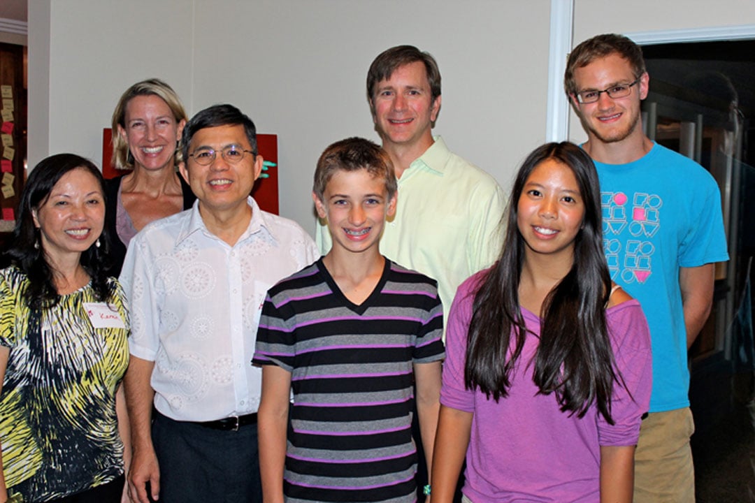 The Work family hosts missionary pastors Ut To and Karen Vo To in Michigan. Pictured: Karen, Julie, Ut, Byron, George, Grace, Charlie. PHOTO: COURTESY JULIE WORK