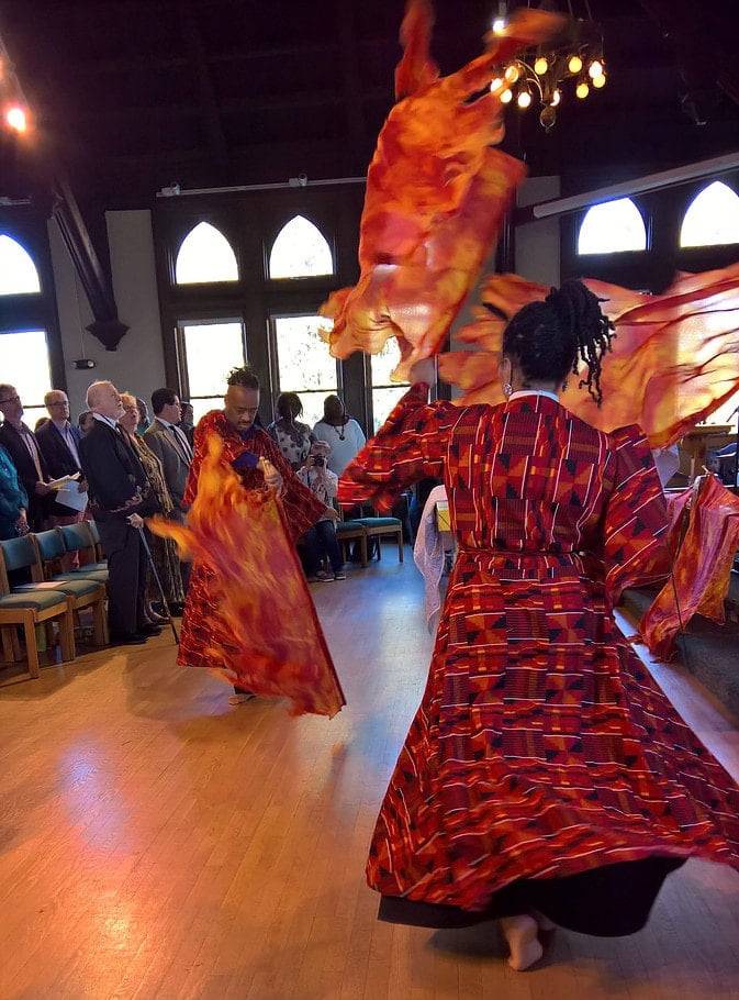 Liturgical dancers use flame-shaped banners. Courtesy photo from the Rev. Todd Pick's website, www.wordmadeimage.com.