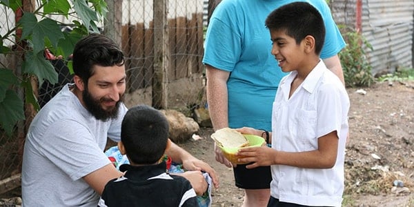 student working with international missionary