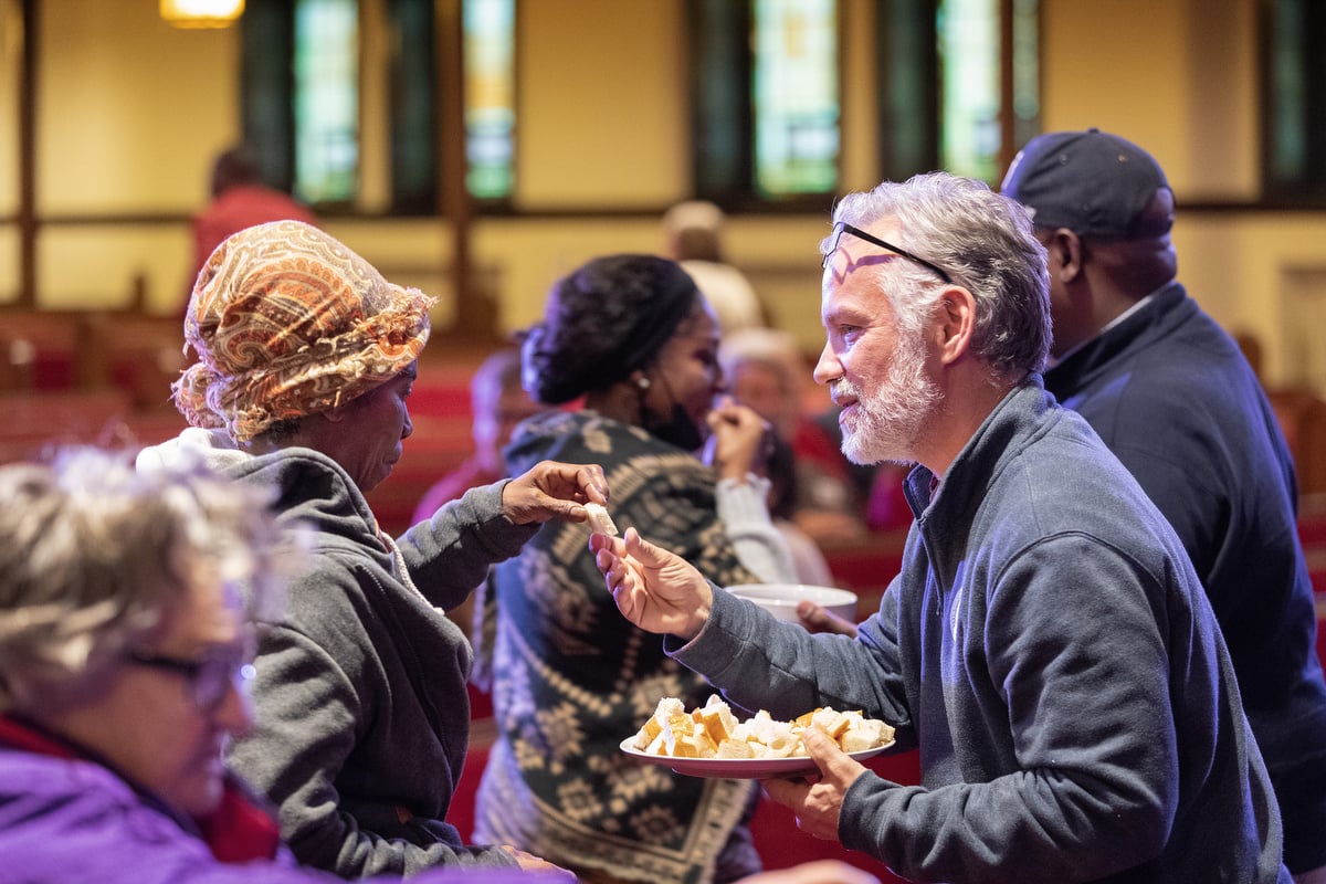 Pastor Tim Jackson serves Holy Communion at Magnolia Avenue United Methodist Church in Knoxville, Tenn. Photo by Mike DuBose, UM News.